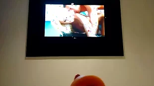 Mature wife enjoys a movie in a motel room